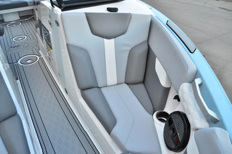 Slide: The Image of 2024 MasterCraft XT22 T boat interior with gray seating and stylish flooring. - 13