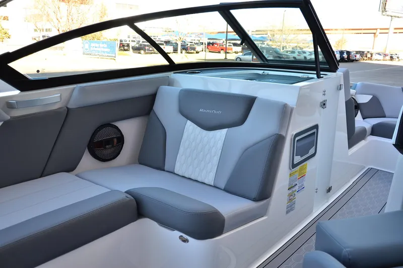 Slide: The Image of 2024 MasterCraft XT22 T boat interior with sleek gray seating and modern design. - 15