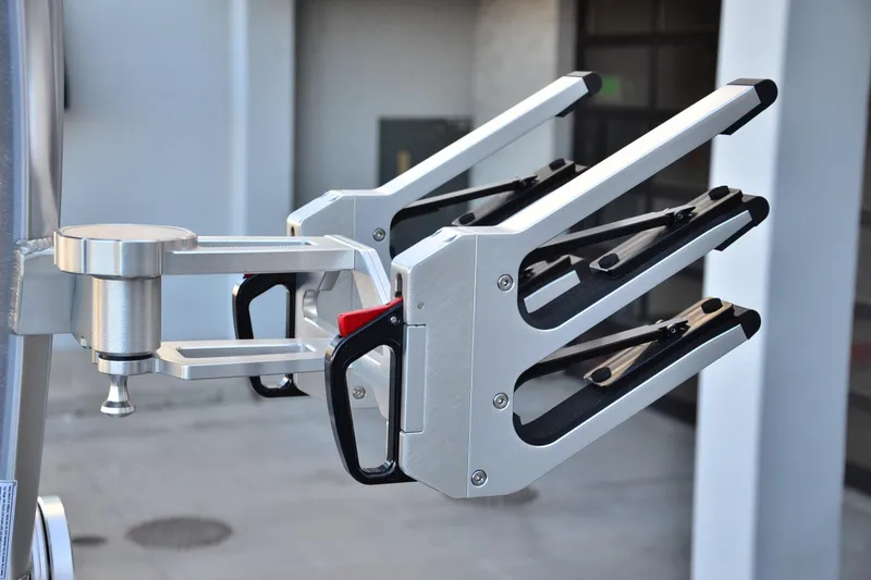 Slide: The Image of 2024 MasterCraft XT22 T wakeboard rack, sleek aluminum design, mounted on boat. - 21