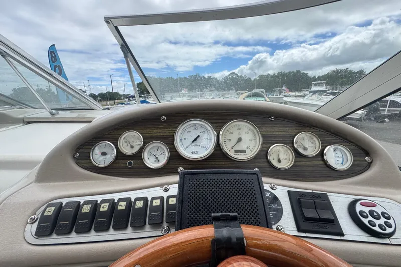 Slide: The Image of Dashboard view of a 2008 Larson Cabrio 260 boat with gauges and controls. - 23