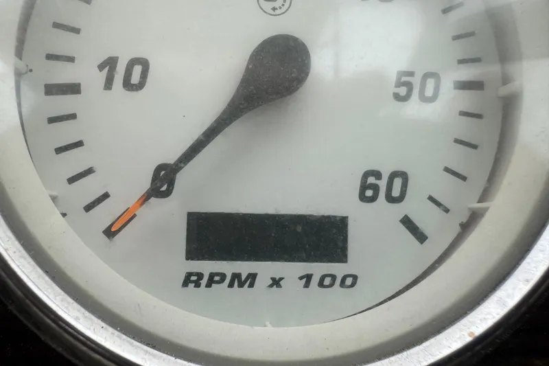 Slide: The Image of Tachometer of 2008 Larson Cabrio 260 showing RPM x 100. - 24