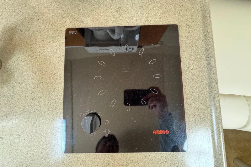 Slide: The Image of Stove control panel on 2008 Larson Cabrio 260 boat kitchen countertop. - 39