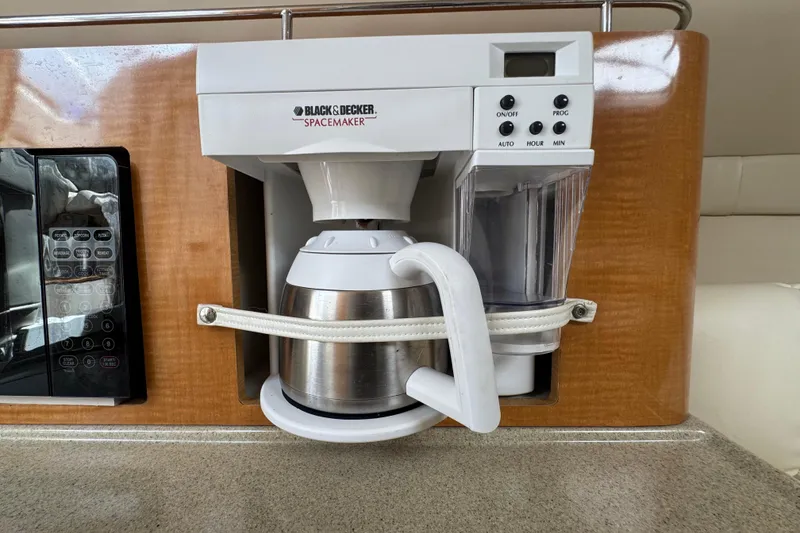 Slide: The Image of Built-in Black & Decker coffee maker in 2008 Larson Cabrio 260 boat kitchen. - 40