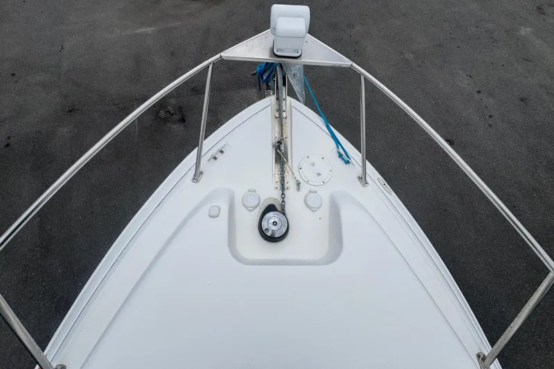 Slide: The Image of Top view of 2008 Larson Cabrio 260 boat deck with railing and anchor. - 56