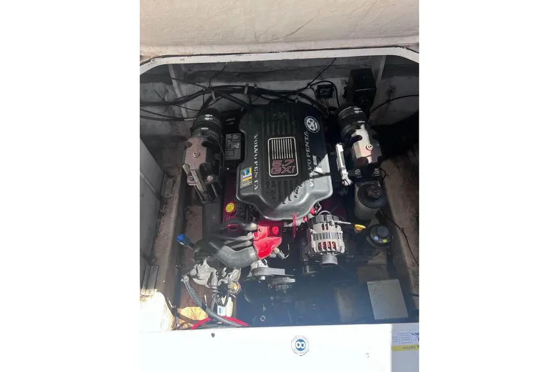 Slide: The Image of Engine compartment of a 2008 Larson Cabrio 260 boat, featuring a Volvo Penta engine. - 6