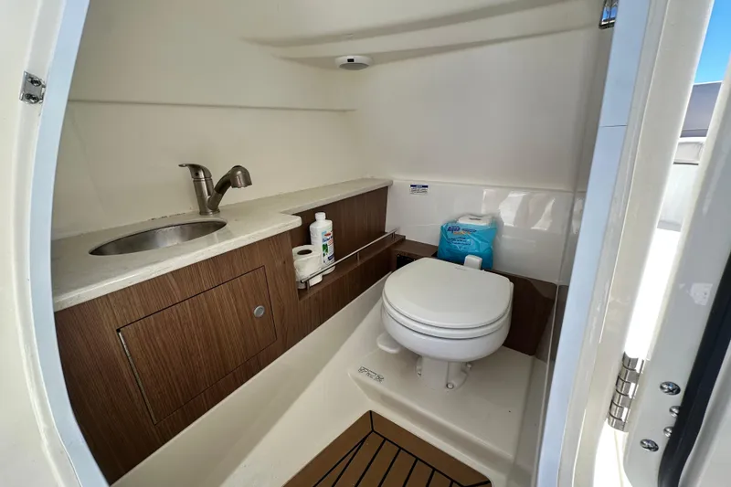 Slide: The Image of 2017 Boston Whaler 270 Vantage boat bathroom with sink and toilet. - 30