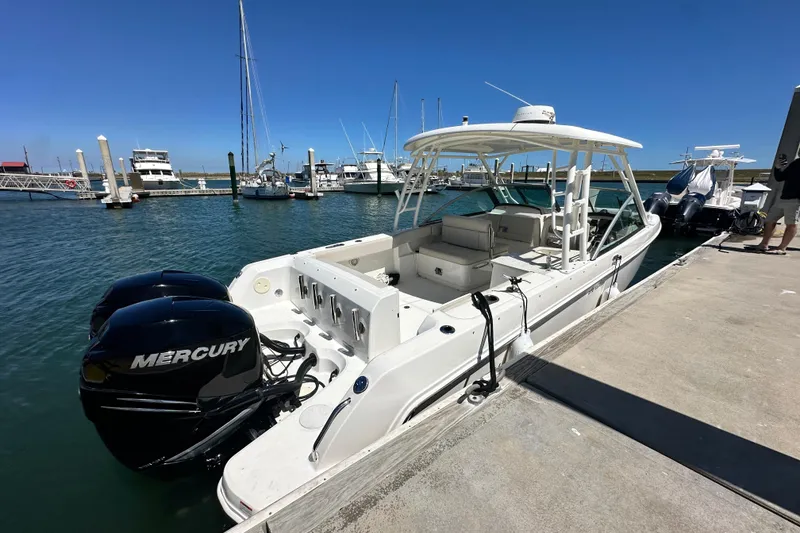Slide: The Image of 2017 Boston Whaler 270 Vantage docked, featuring dual Mercury engines. - 41