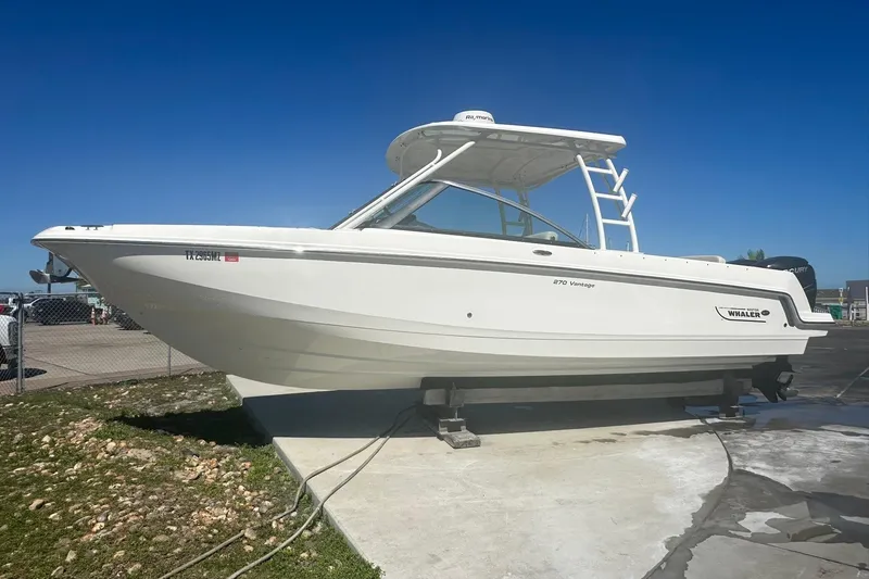 Slide: The Image of 2017 Boston Whaler 270 Vantage boat on display under clear blue sky. - 42