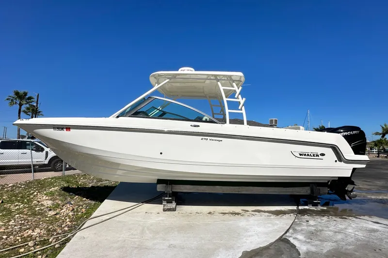 Slide: The Image of 2017 Boston Whaler 270 Vantage boat on display under clear blue sky. - 43
