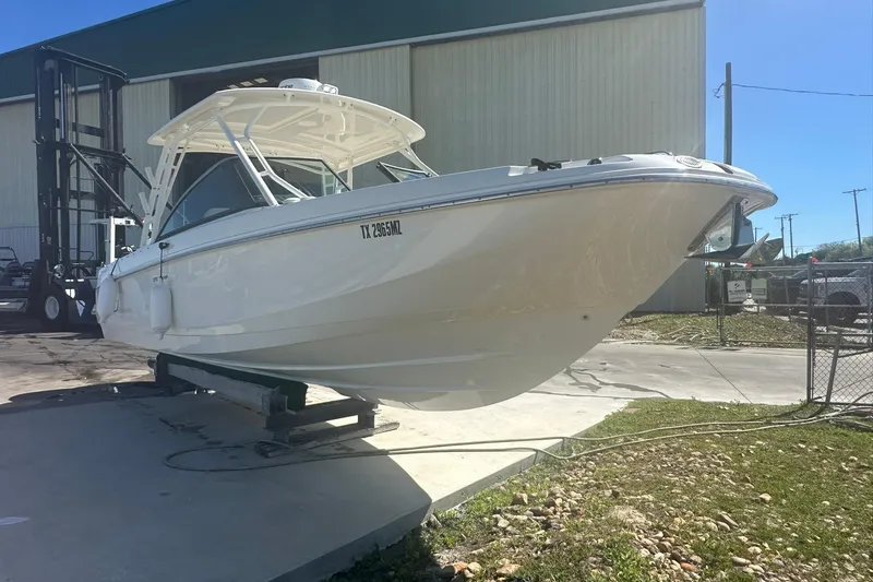 Slide: The Image of 2017 Boston Whaler 270 Vantage boat on display outdoors. - 45