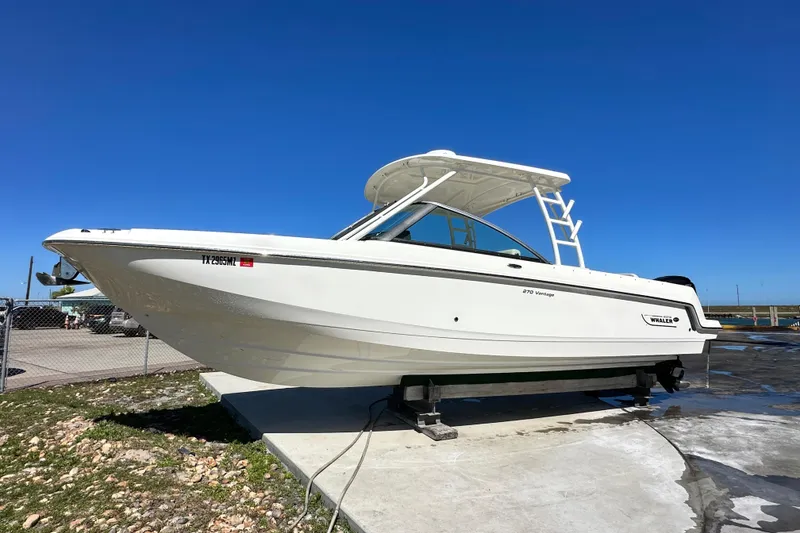 Slide: The Image of 2017 Boston Whaler 270 Vantage boat on display under clear blue sky. - 47