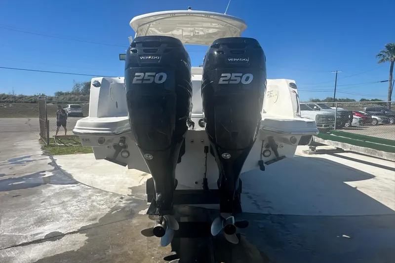 Slide: The Image of 2017 Boston Whaler 270 Vantage with twin 250 horsepower engines, docked outdoors. - 48