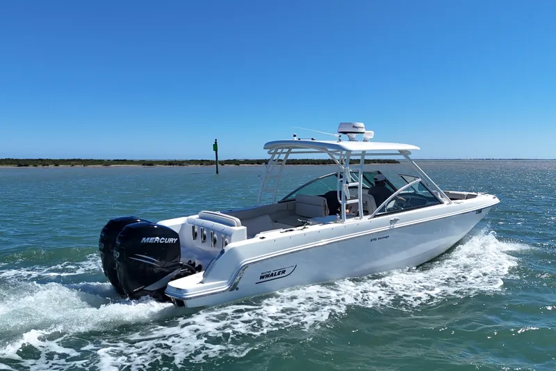 Slide: The Image of 2017 Boston Whaler 270 Vantage boat cruising on open water. - 6