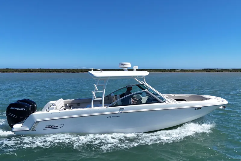Slide: The Image of 2017 Boston Whaler 270 Vantage cruising on a sunny day. - 9