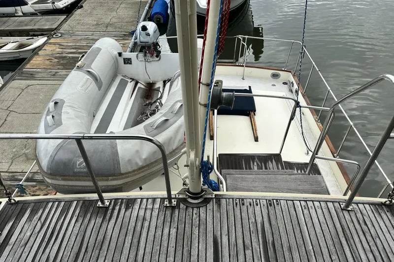 Slide: The Image of 1979 Grand Banks 42 Classic yacht with inflatable dinghy on deck. - 12