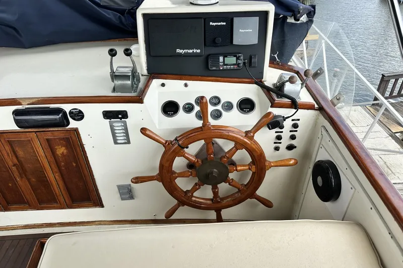 Slide: The Image of 1979 Grand Banks 42 Classic helm with wooden wheel and Raymarine navigation system. - 15