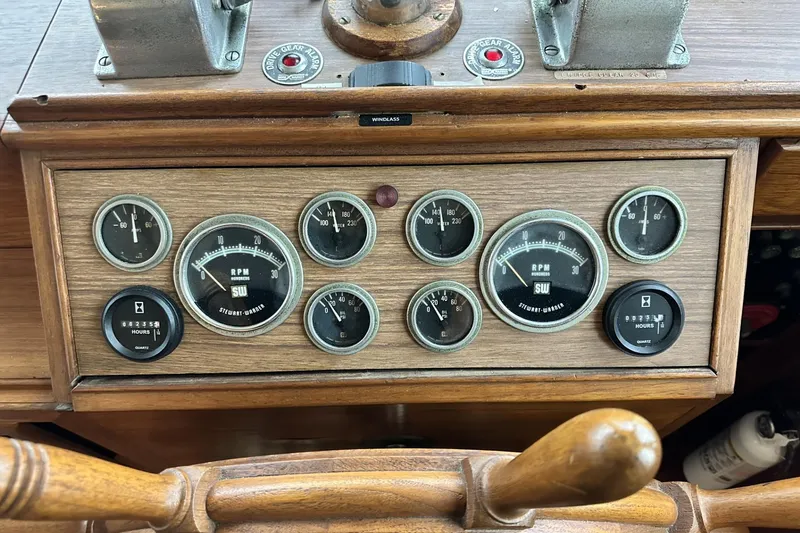 Slide: The Image of Dashboard of a 1979 Grand Banks 42 Classic boat with gauges and controls. - 26