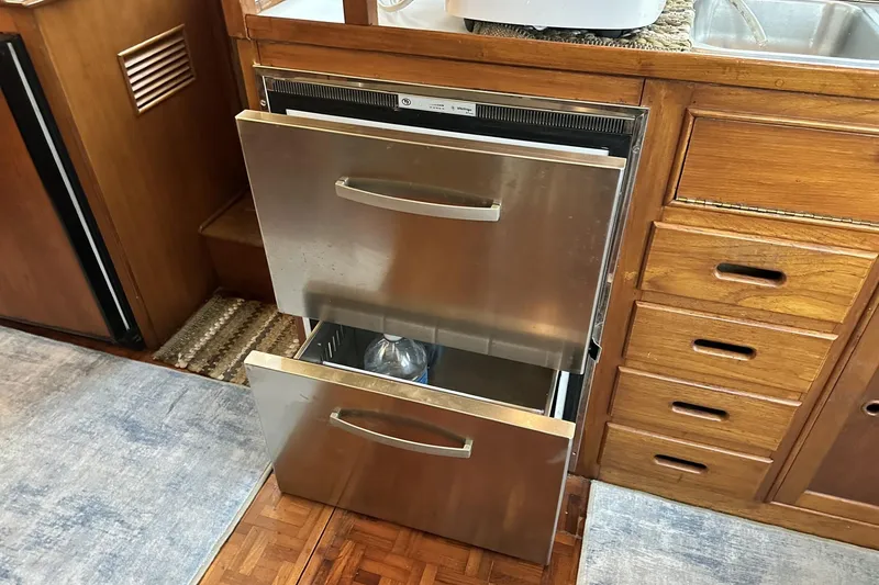 Slide: The Image of Stainless steel drawers in 1979 Grand Banks 42 Classic yacht kitchen interior. - 30