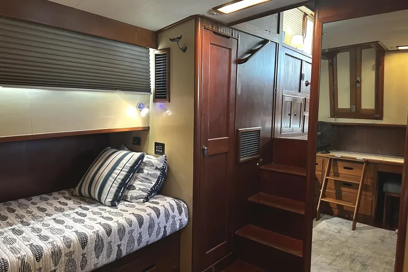 Slide: The Image of Cozy cabin interior of 1979 Grand Banks 42 Classic yacht with wooden furnishings and bed. - 33