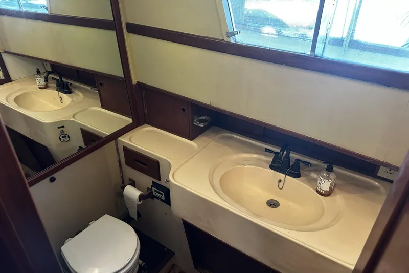 Slide: The Image of Bathroom interior of a 1979 Grand Banks 42 Classic yacht with sink and toilet. - 38