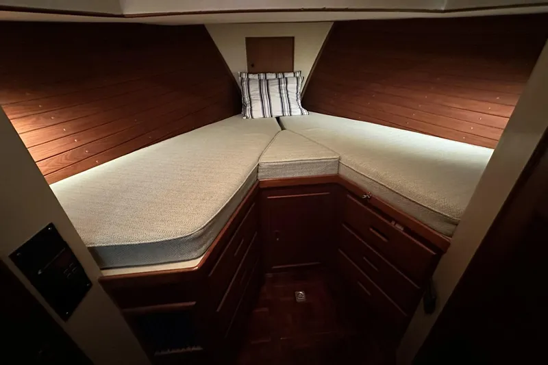 Slide: The Image of Cozy cabin interior of 1979 Grand Banks 42 Classic yacht with wooden paneling. - 39