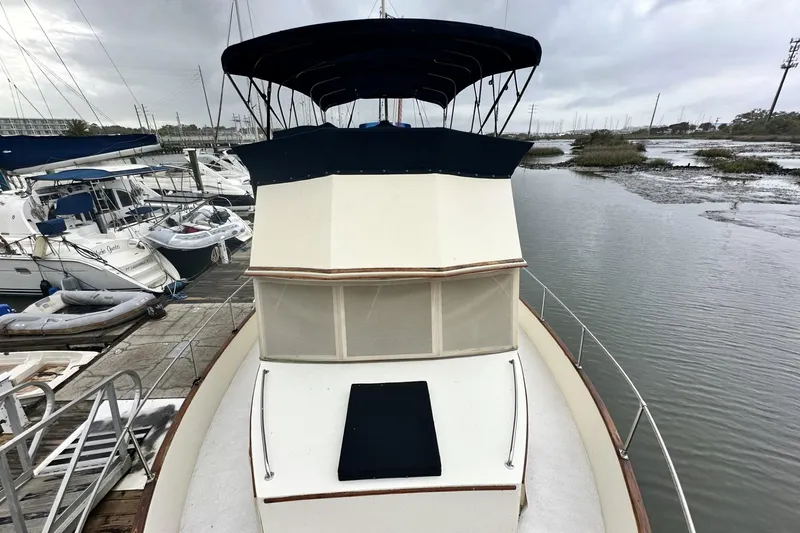 Slide: The Image of 1979 Grand Banks 42 Classic yacht docked at marina, overcast sky. - 4