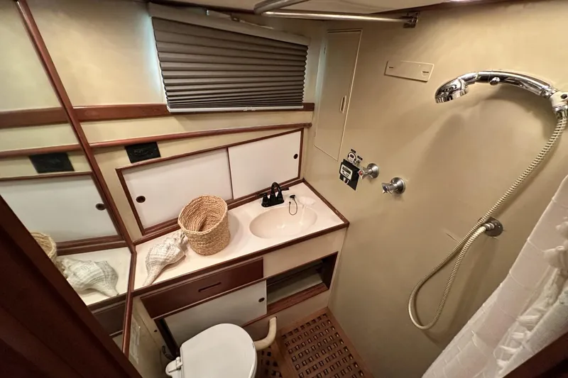 Slide: The Image of Bathroom interior of 1979 Grand Banks 42 Classic yacht with shower and sink. - 42