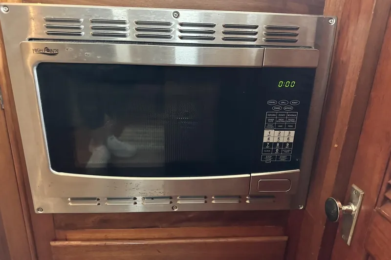 Slide: The Image of Built-in microwave on 1979 Grand Banks 42 Classic yacht, stainless steel finish. - 47