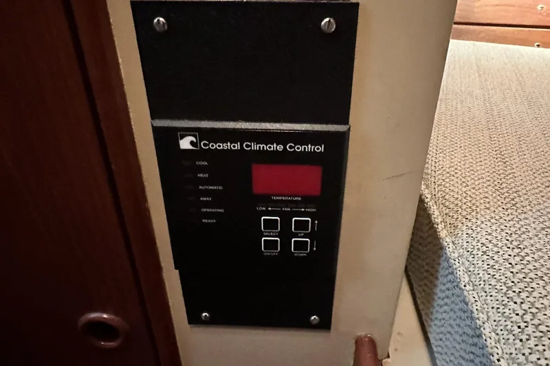 Slide: The Image of Coastal Climate Control panel on 1979 Grand Banks 42 Classic yacht interior. - 48