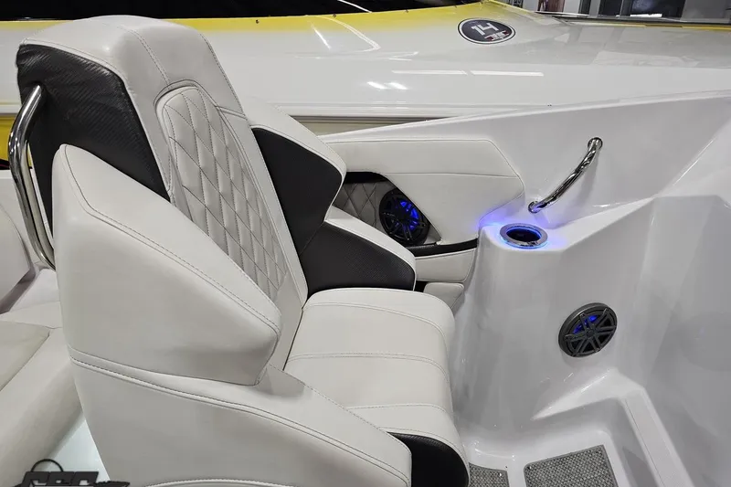 Slide: The Image of Luxurious interior of 2018 Baja 24 Outlaw boat with plush seating and ambient lighting. - 106