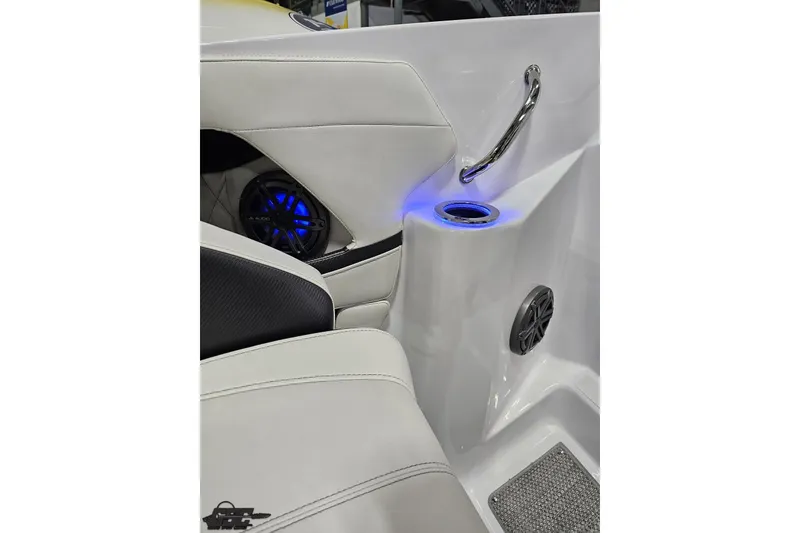 Slide: The Image of Interior of 2018 Baja 24 Outlaw boat with illuminated cup holder and speakers. - 107