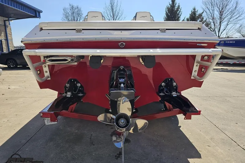 Slide: The Image of Rear view of a 2018 Baja 24 Outlaw boat with dual propellers. - 28
