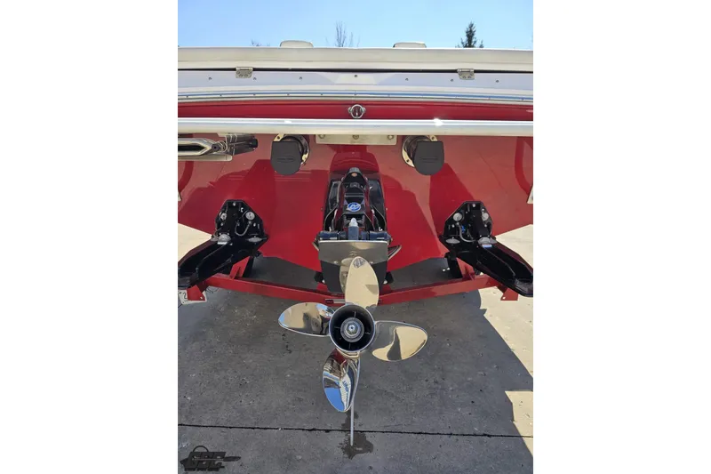 Slide: The Image of Rear view of a 2018 Baja 24 Outlaw boat with shiny propeller. - 29