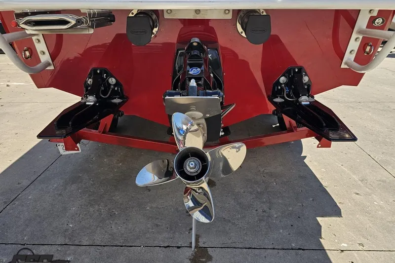 Slide: The Image of Rear view of a 2018 Baja 24 Outlaw boat with a shiny propeller. - 30