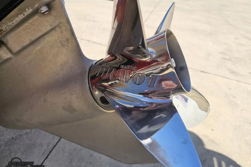 Slide: The Image of Close-up of a Mercury Marine Bravo I propeller on a 2018 Baja 24 Outlaw boat. - 35