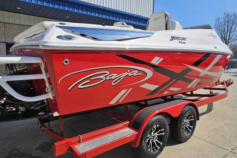 Slide: The Image of 2018 Baja 24 Outlaw speedboat with red and white design on a trailer. - 36