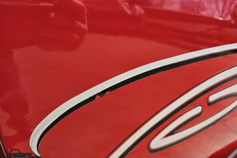 Slide: The Image of Close-up of 2018 Baja 24 Outlaw's red exterior with graphic detail. - 37