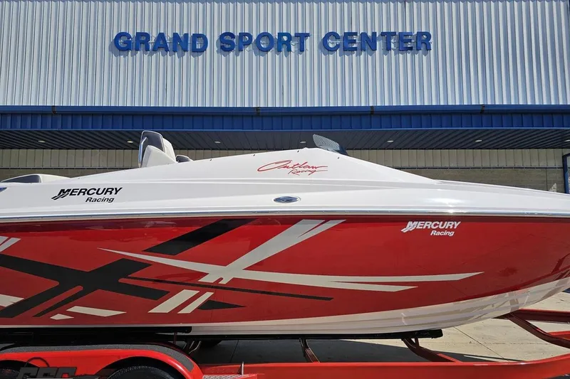 Slide: The Image of 2018 Baja 24 Outlaw boat with red and white design at Grand Sport Center. - 4