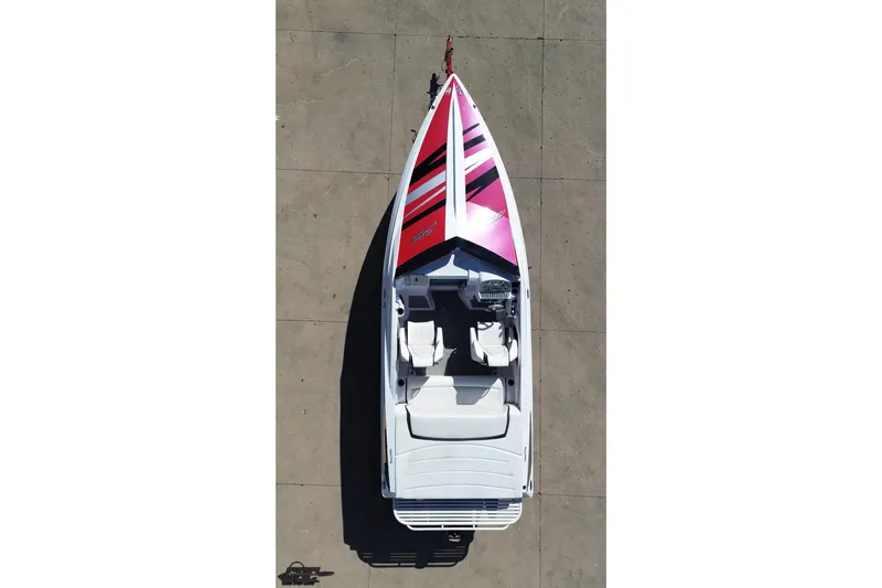 Slide: The Image of Overhead view of a 2018 Baja 24 Outlaw speedboat with vibrant red and black design. - 40