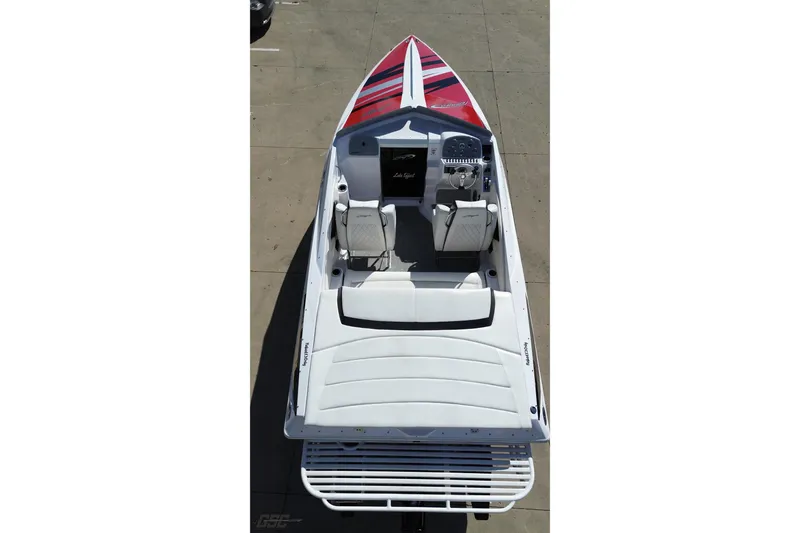 Slide: The Image of 2018 Baja 24 Outlaw boat, aerial view, showcasing sleek design and seating arrangement. - 41