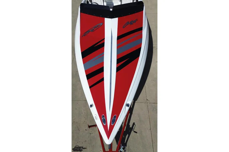 Slide: The Image of 2018 Baja 24 Outlaw boat with red, black, and gray design on deck. - 44
