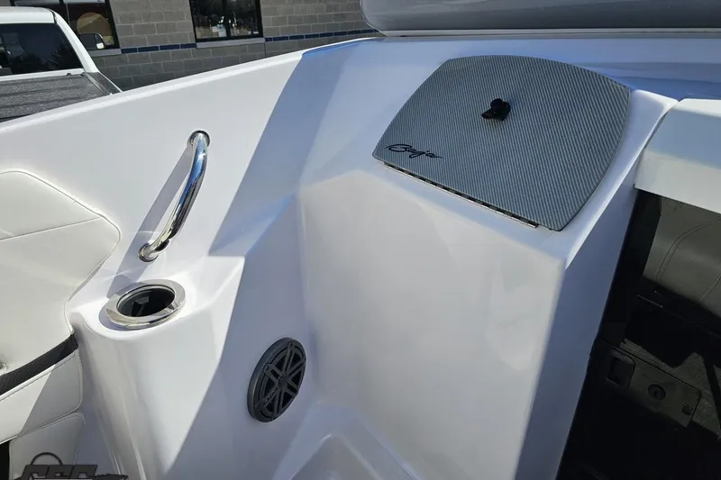 Slide: The Image of Interior of 2018 Baja 24 Outlaw boat with cup holder and speaker. - 63