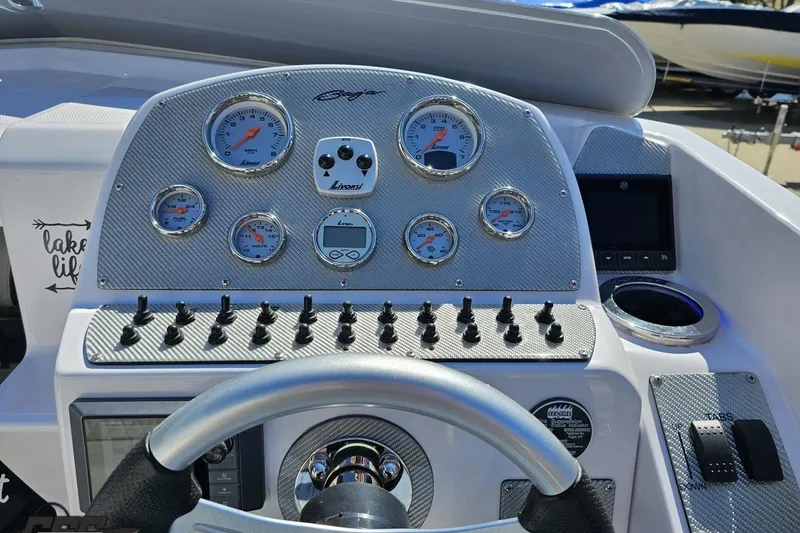 Slide: The Image of Dashboard of a 2018 Baja 24 Outlaw boat with gauges and controls. - 69
