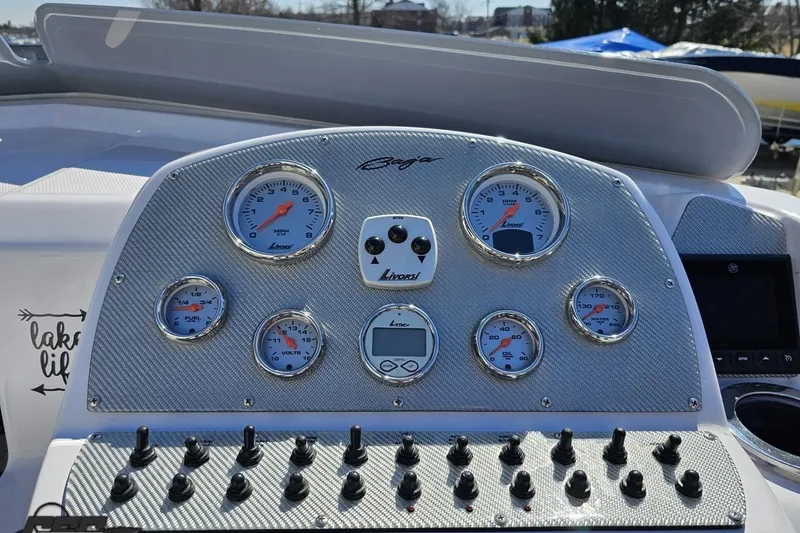 Slide: The Image of Dashboard of a 2018 Baja 24 Outlaw boat with gauges and controls. - 70