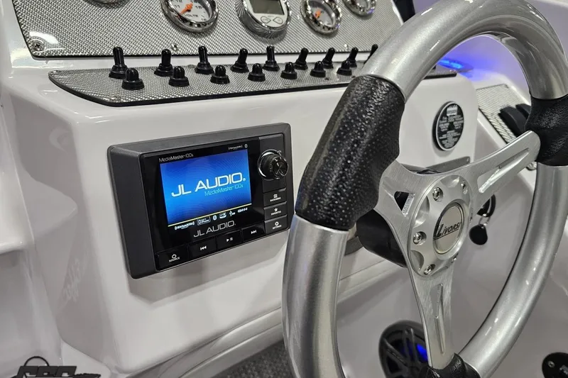 Slide: The Image of 2018 Baja 24 Outlaw dashboard featuring JL Audio system and Livorsi steering wheel. - 75