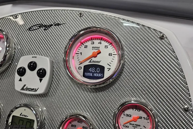 Slide: The Image of Dashboard of 2018 Baja 24 Outlaw boat with Livorsi gauges and carbon fiber finish. - 77