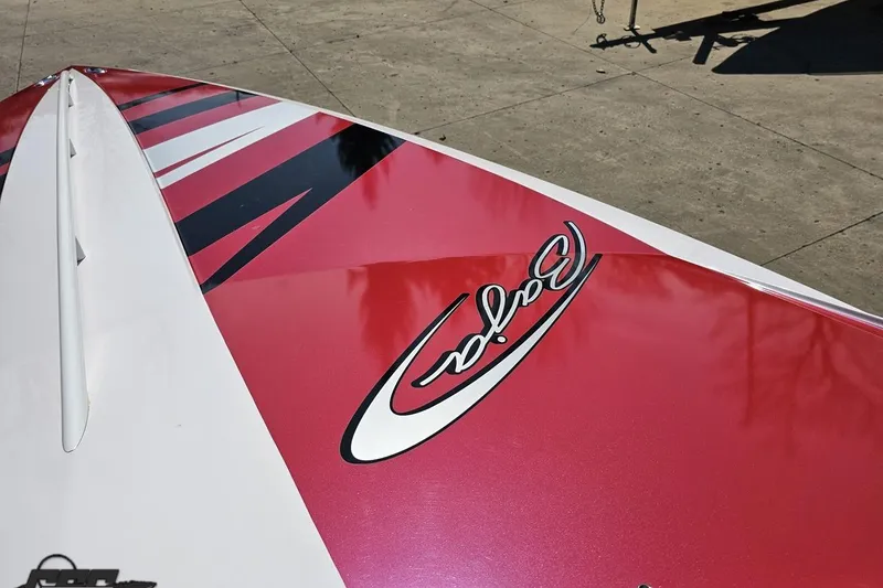 Slide: The Image of 2018 Baja 24 Outlaw boat with red and white design on deck. - 81
