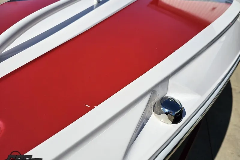 Slide: The Image of Red and white 2018 Baja 24 Outlaw boat detail with chrome fixture. - 83