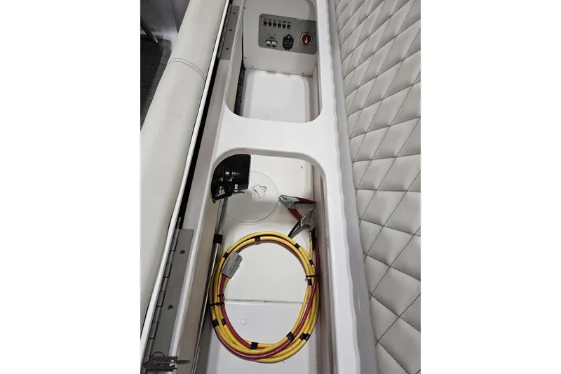 Slide: The Image of 2018 Baja 24 Outlaw interior storage with cables and quilted upholstery. - 91