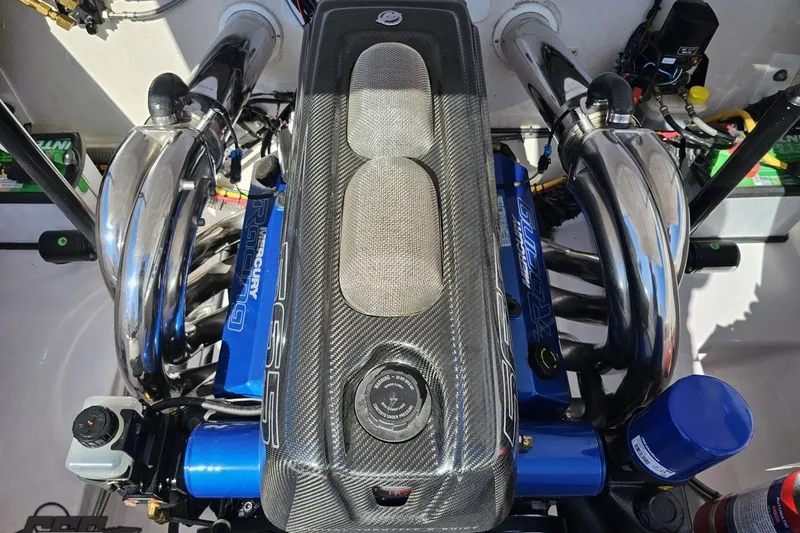 Slide: The Image of 2018 Baja 24 Outlaw engine with carbon fiber cover and chrome exhaust. - 95